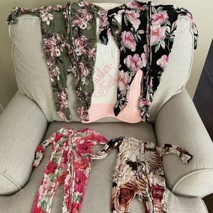 4 posh peanut onesies. Black one  shows signs of wash due to dark color. GUC.